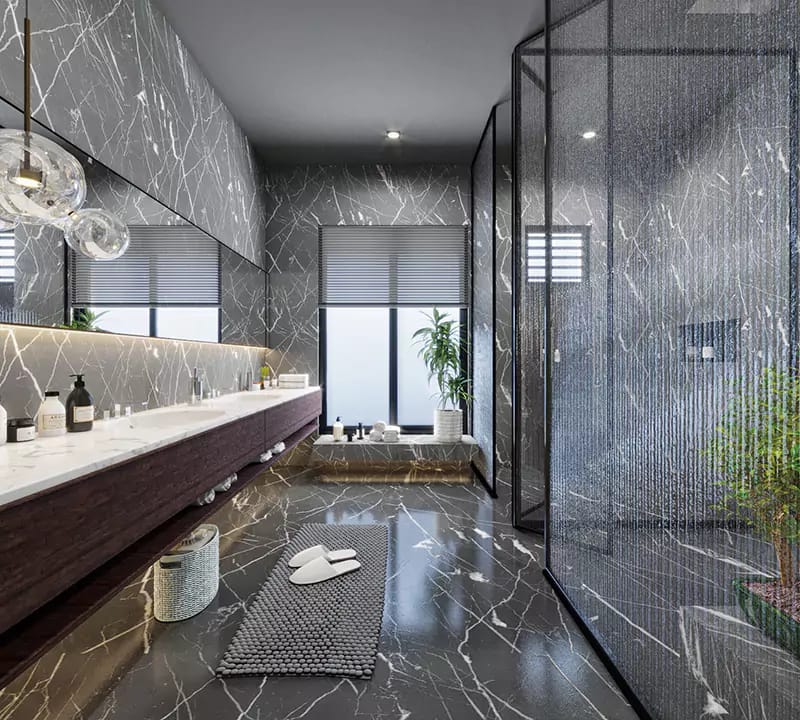 Marble bathroom with floating vanity, glass-brick walk-in shower and grey patterned rug, Hyderabad