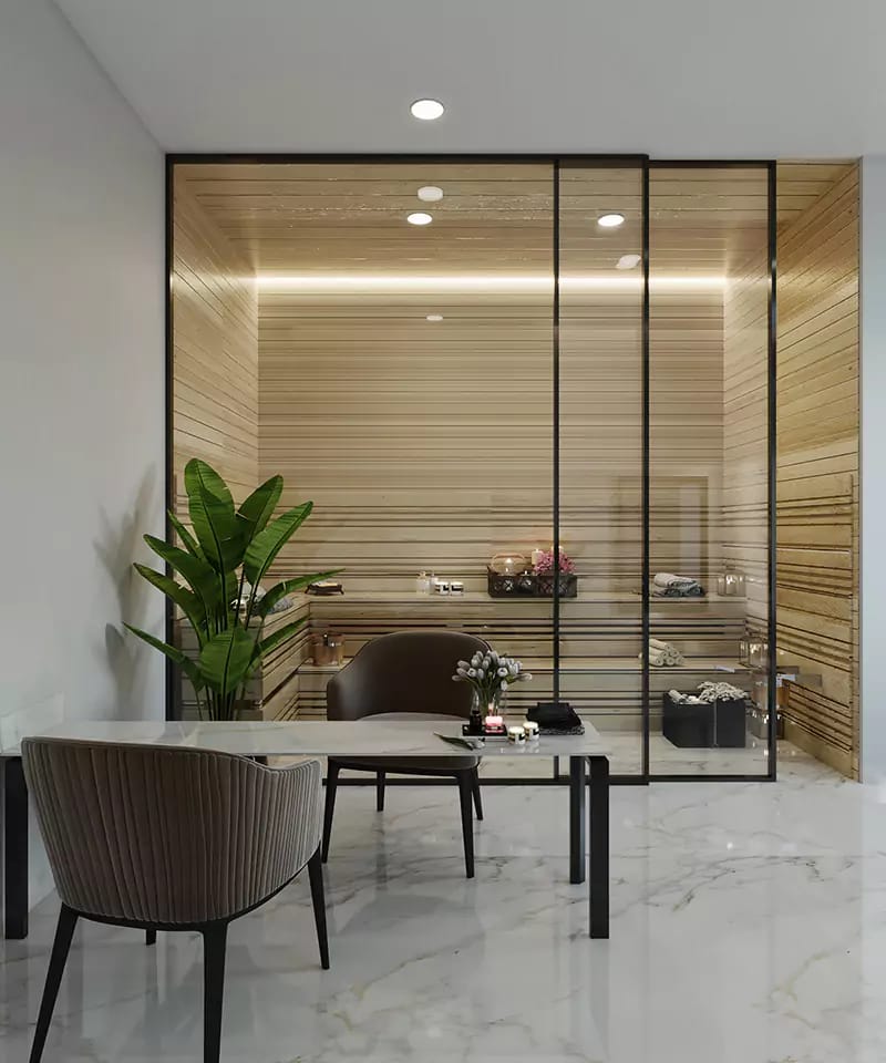 Glass-partitioned dressing or spa room with timber slat walls, marble floor and ribbed accent chairs, Hyderabad