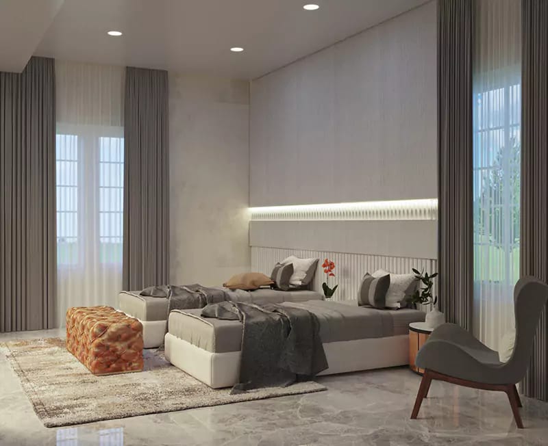 Master bedroom in Hyderabad with fluted headboard, grey floor-to-ceiling drapes, low platform bed and accent armchair