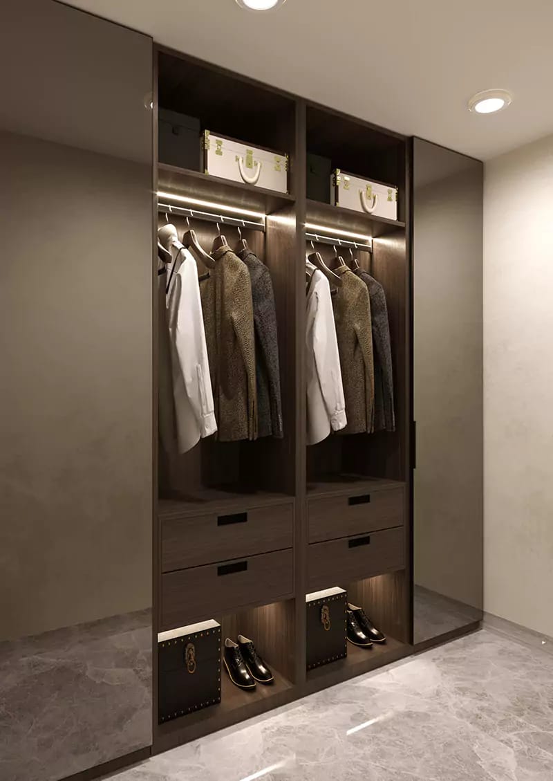 Walk-in closet in dark wood with backlit hanging rails, drawers and open shoe storage on marble floor, Hyderabad