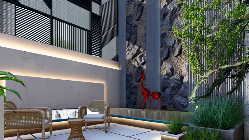 Courtyard seating with rattan chairs, a backlit marble wall, rock-clad feature panel and red wire sculpture, Hyderabad