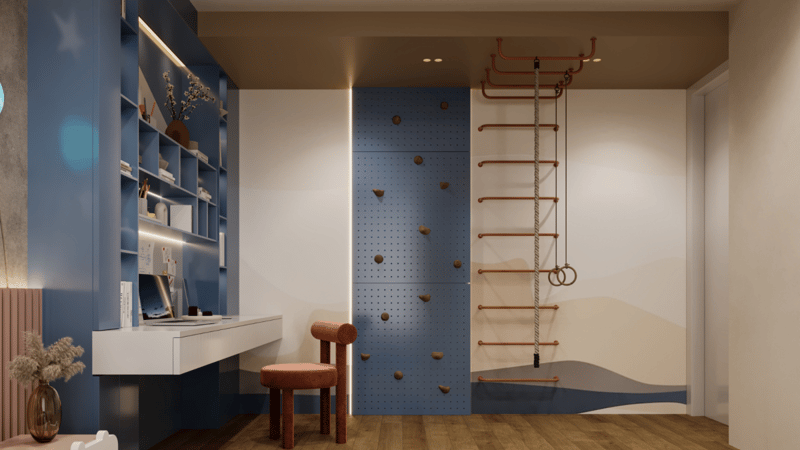 Children's room corner with blue built-in shelving, white study desk and a climbing wall with rope ladder