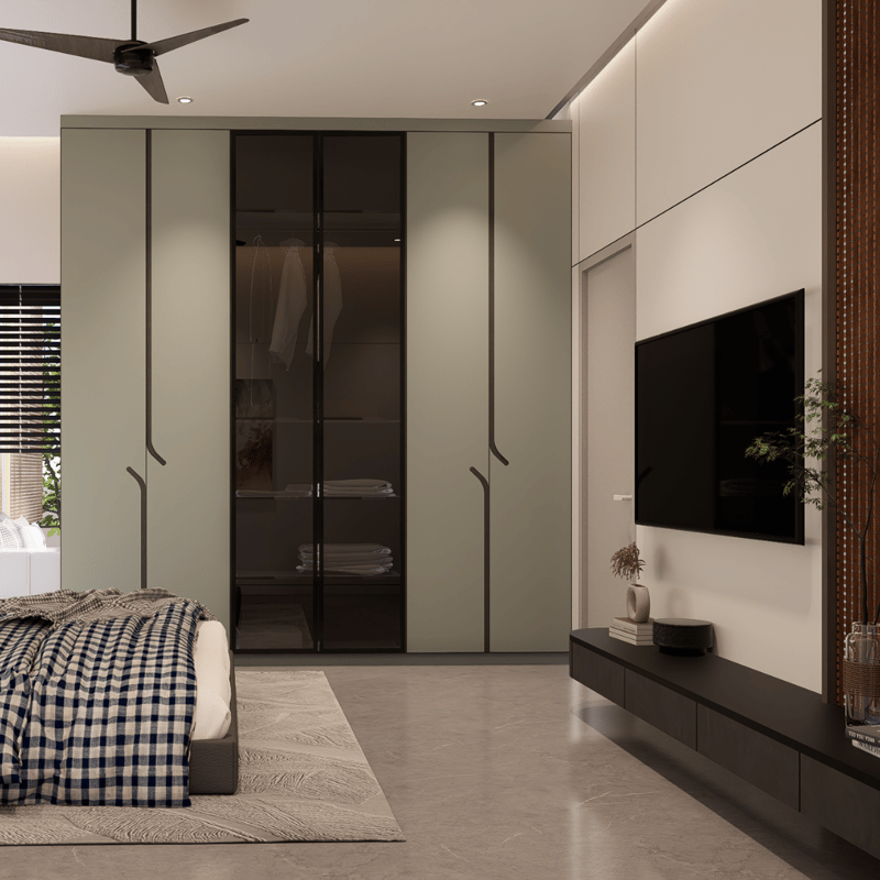 Bedroom with sage and smoked-glass wardrobe, wall-mounted TV on cream panelling and blue checked bedding, Hyderabad