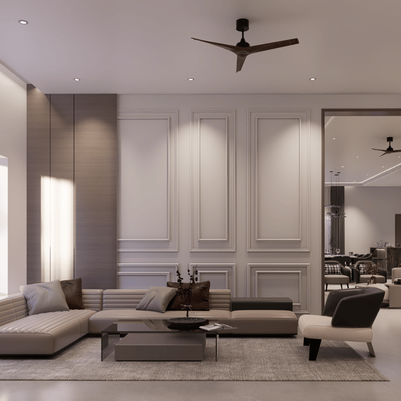 Living room with white wainscot wall panelling, low grey sectional sofa and a pale area rug, Hyderabad