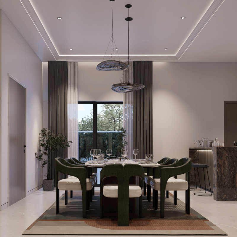 Dining room with marble pendant lights, sculptural green velvet chairs and curtained window over a layered rug, Hyderabad