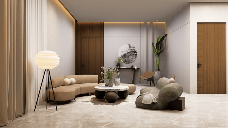 Minimal living corner with tan curved sofa, pebble ottoman, paper floor lamp and walnut feature wall, Hyderabad interior
