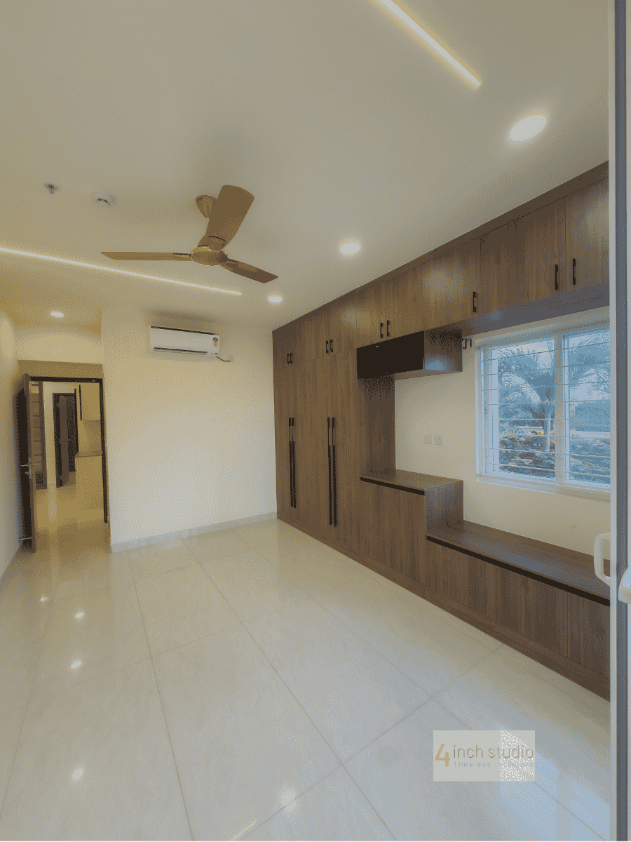 Bedroom with grained-wood wardrobe, wall-mounted TV unit, split AC and large window over glossy tile, Hyderabad