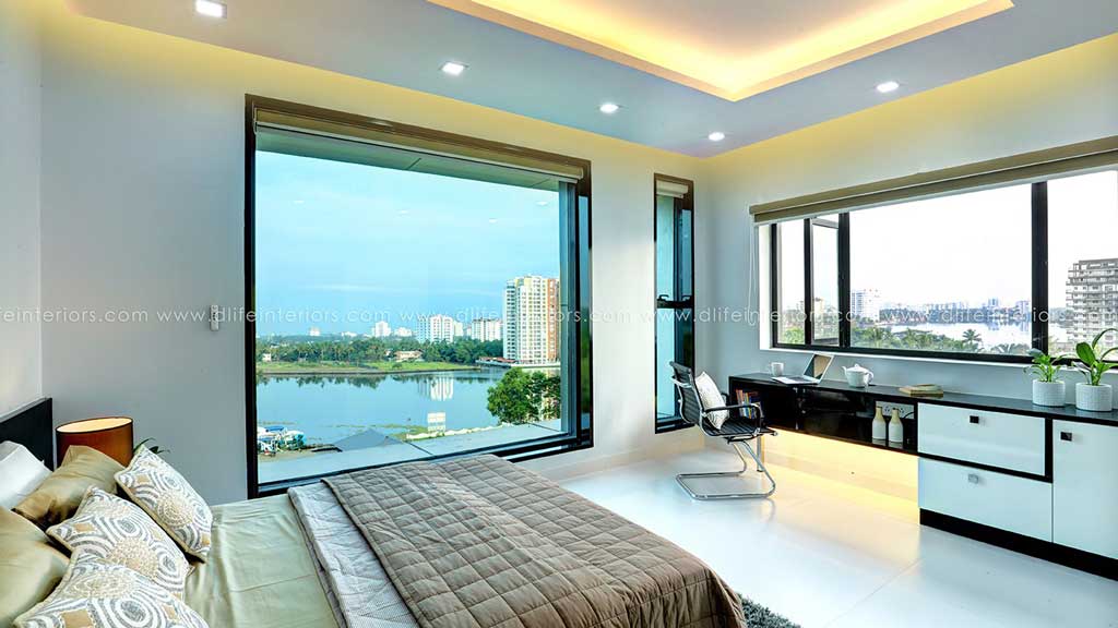 Minimal bedroom with wraparound windows, lake skyline view, quilted bed and long white desk with chair, Hyderabad