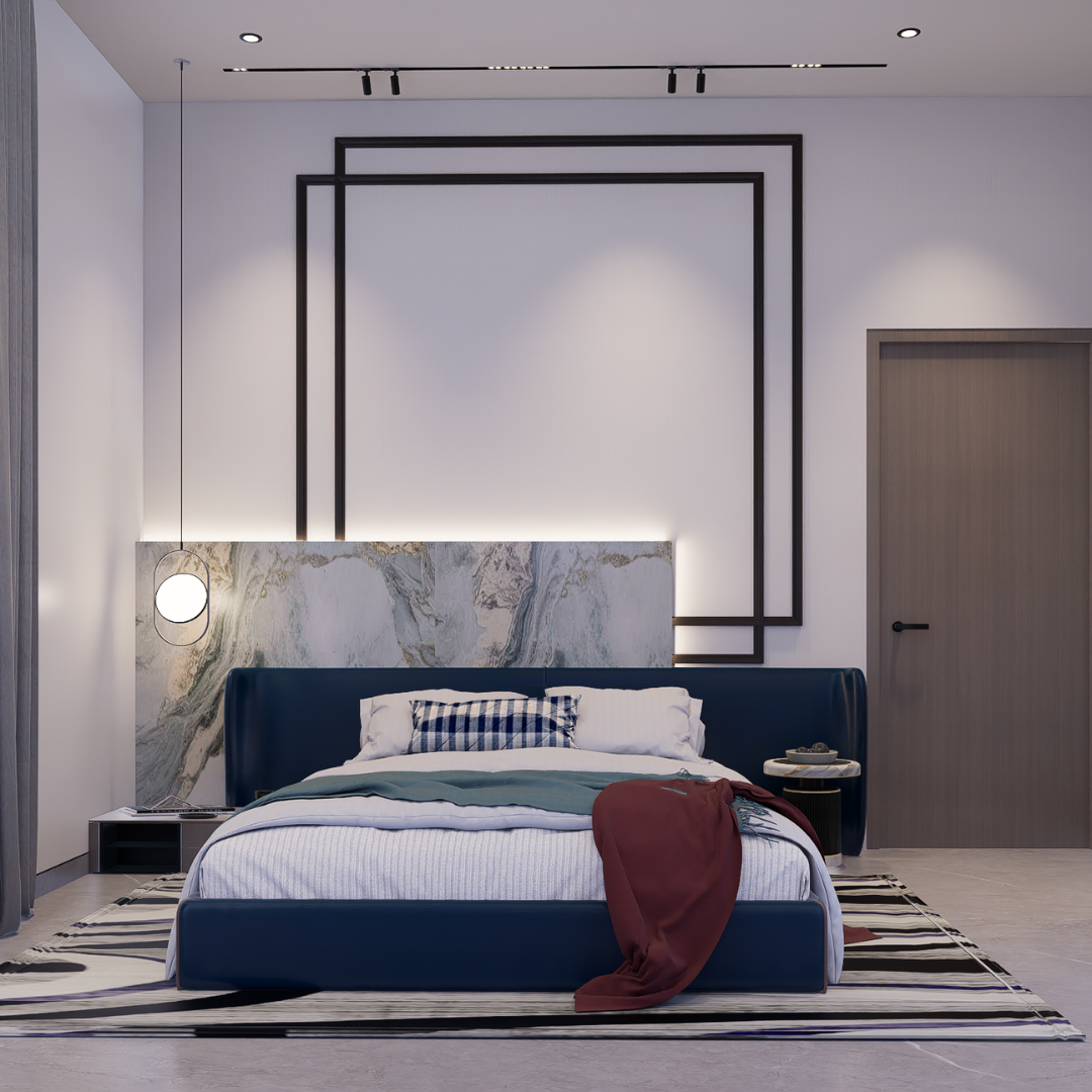Contemporary bedroom with navy upholstered bed, marble headboard panel, layered black-frame wall trim and striped rug, Hyderabad
